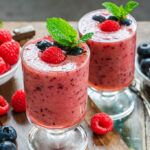 Mixed,Berry,Smoothie,Garnished,With,Fresh,Fruit,And,Mint