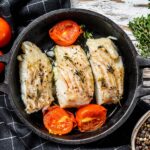 Fried,Cod,Fish,Fillet,With,Spice,In,A,Cast,Iron